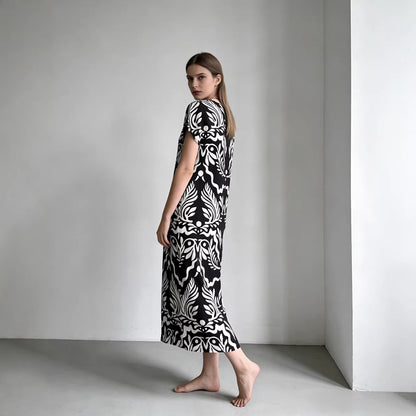 Elegant Loose-fitting Long Dress With A Round Neck And Short Sleeves